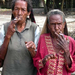 Smoking Papua women with their cut fingers